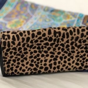 Animal print leather clutch with strap